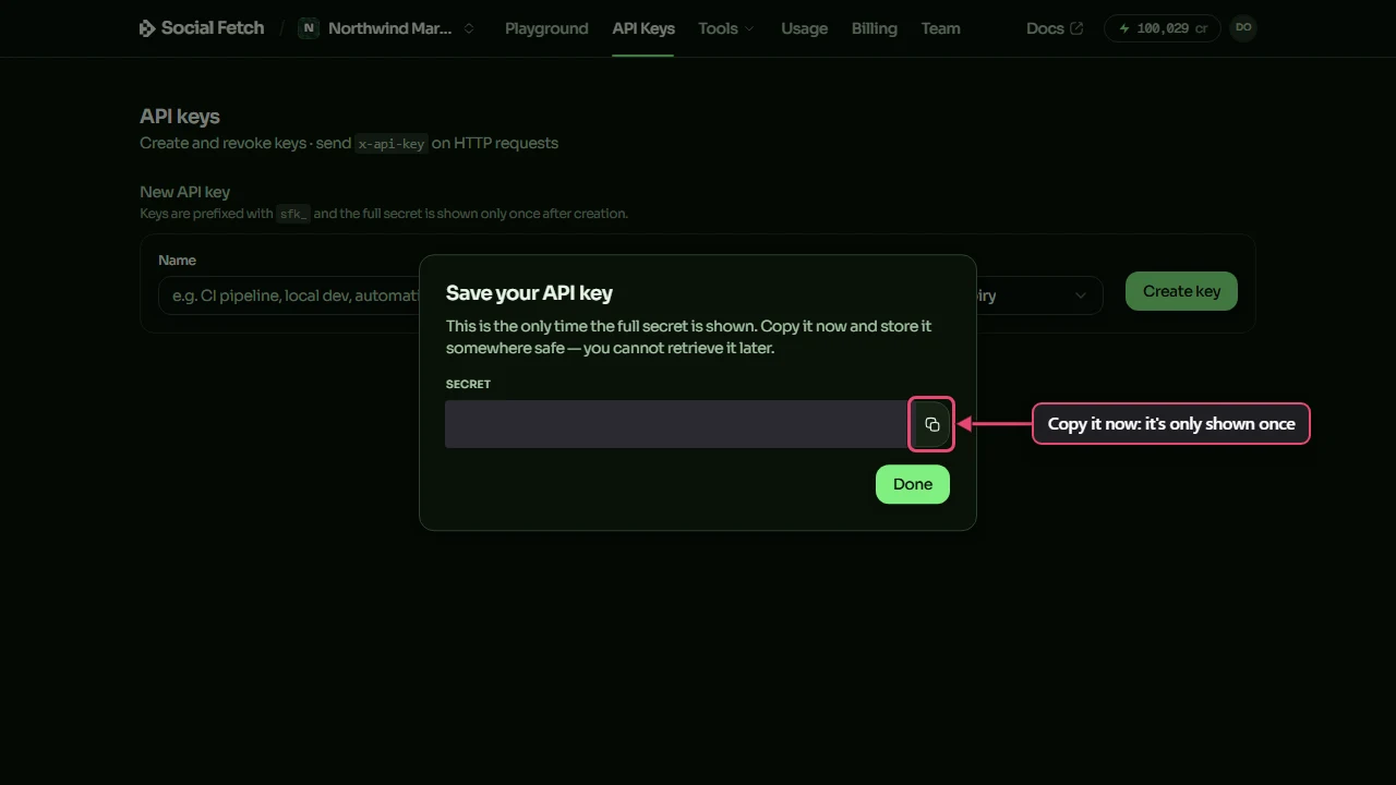 The Save your API key window with the secret covered and the copy button beside it highlighted, labelled Copy it now: it's only shown once